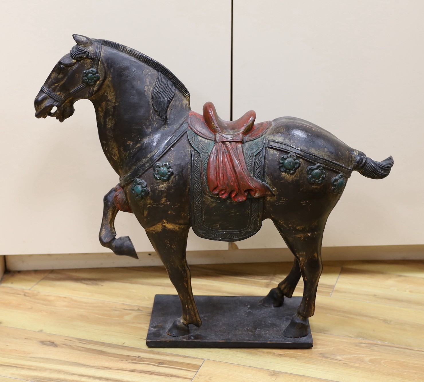 A Chinese carved and painted wood horse, 56cm tall